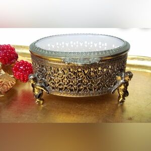 Vintage Gold Filigree Oval Box Glass Lid Cherub Footed jewelry box ormolu 6”